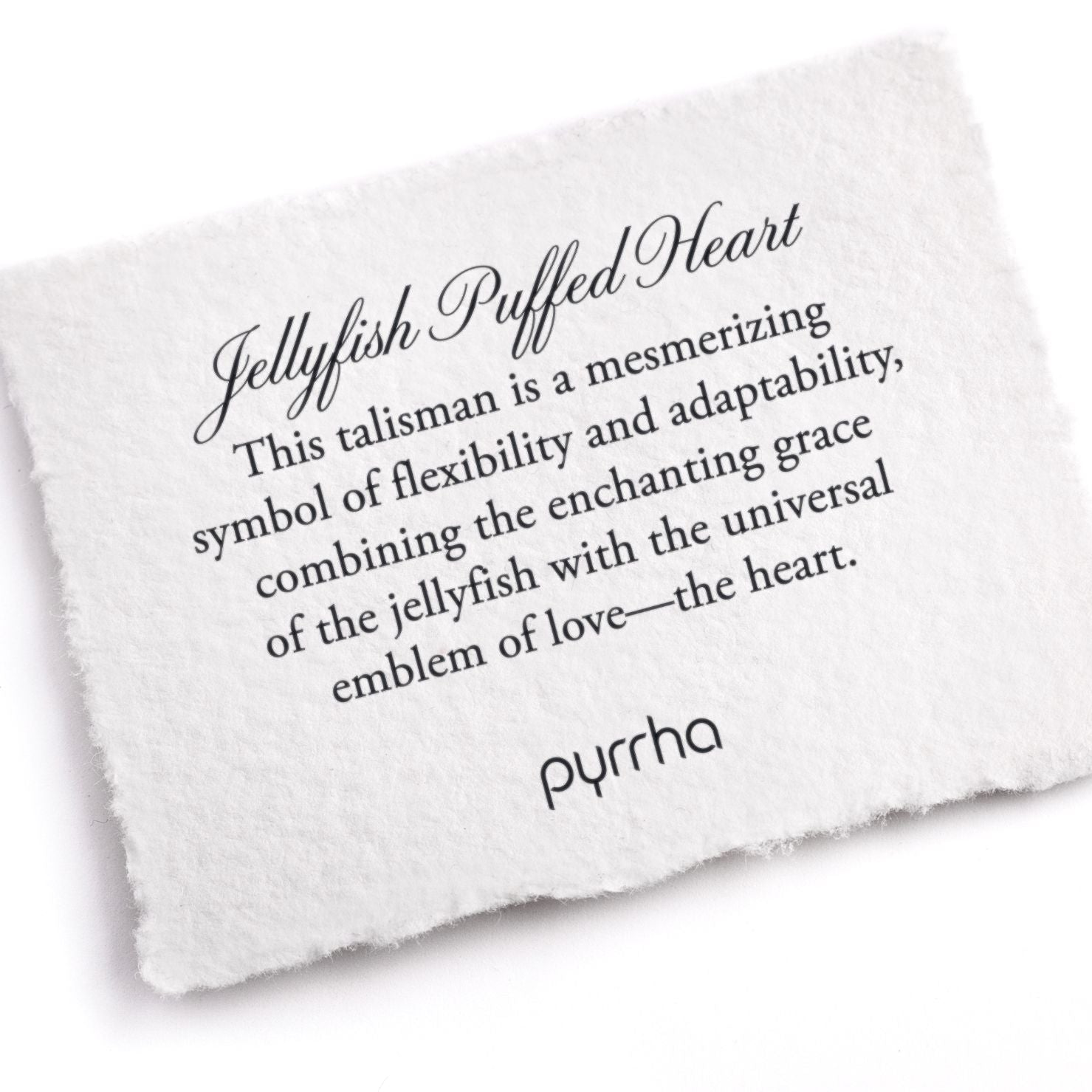 A hand-torn, letterpress printed card describing the meaning for Pyrrha's Jellyfish Puffed Heart Talisman