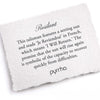 A hand-torn, letterpress printed card describing the meaning for Pyrrha's Resilient Talisman