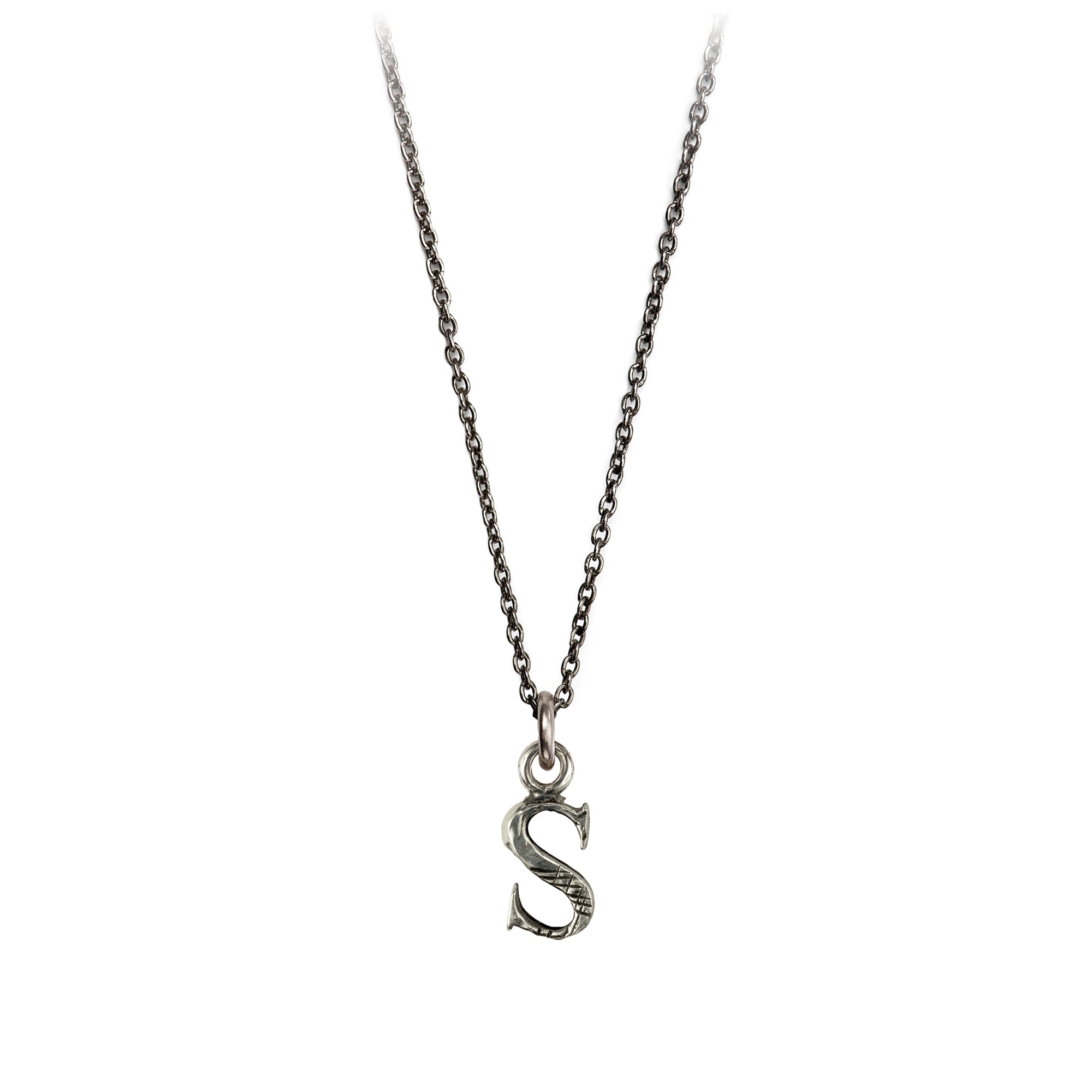 A sterling silver letter "S" charm on a silver chain.