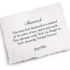 A hand-torn, letterpress printed card describing the meaning for Pyrrha's Shamrock Talisman