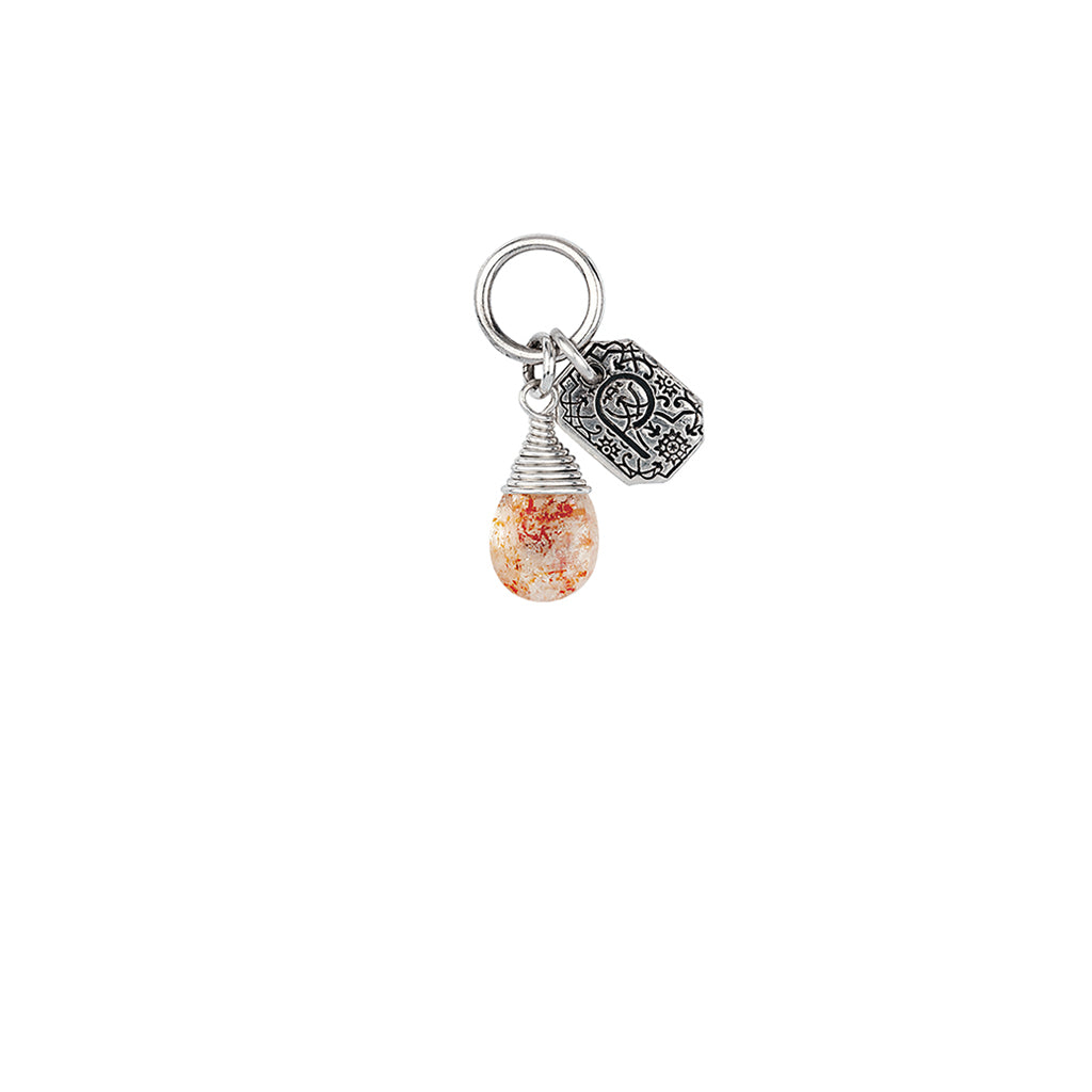 A sterling silver signature attraction charm capped with a sunstone.