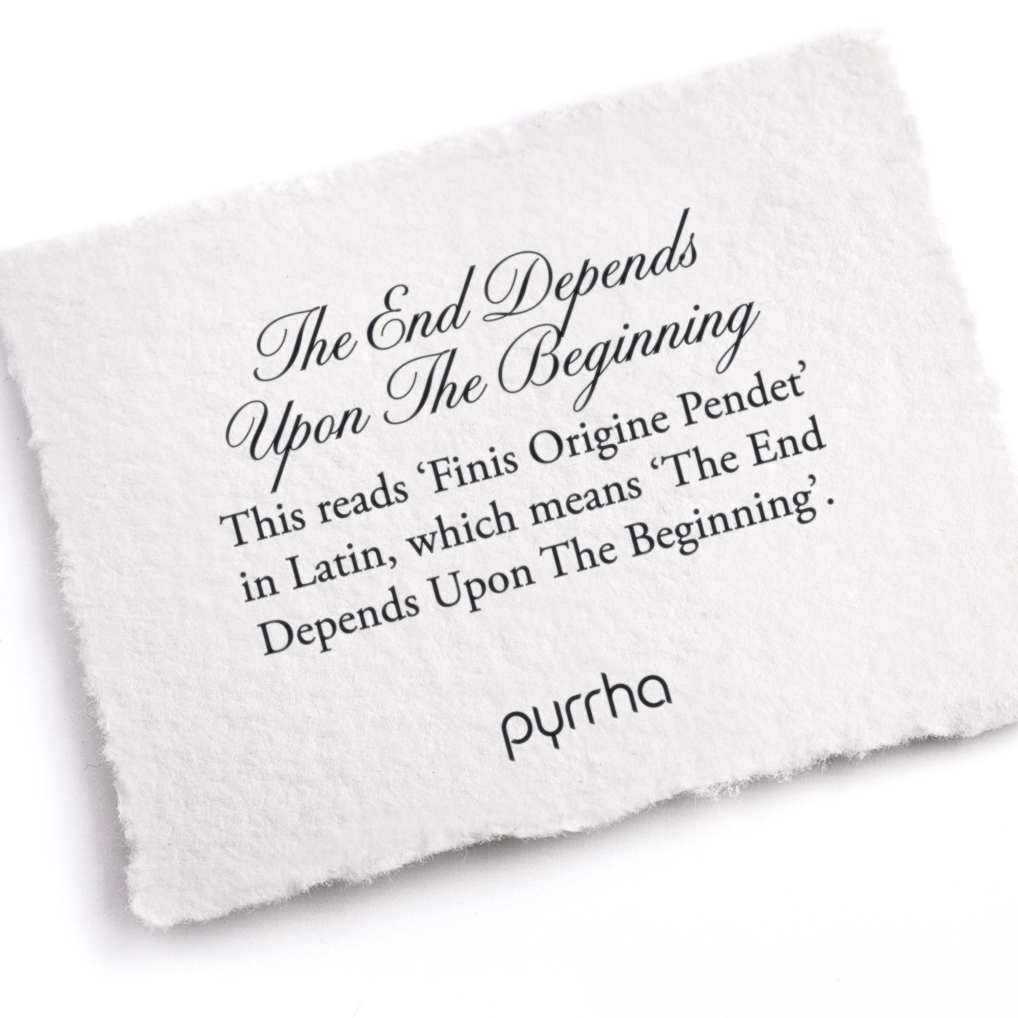 A hand-torn, letterpress printed card describing the meaning for Pyrrha's The End Depends Upon The Beginning Ring