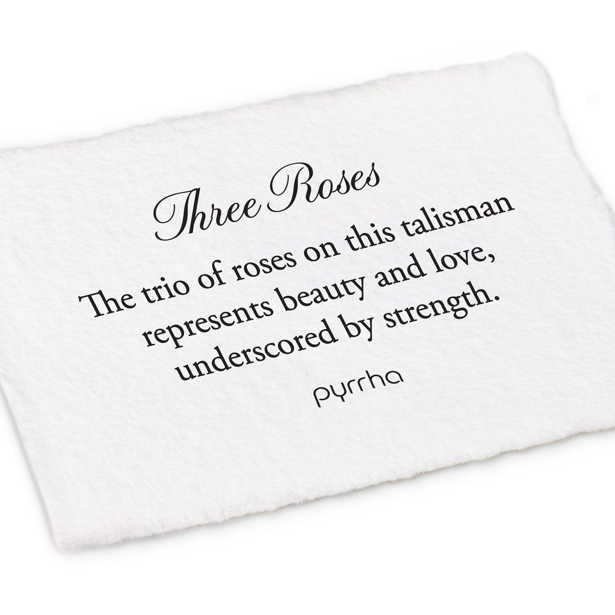 A hand-torn, letterpress printed card describing the meaning for Pyrrha's Three Roses Talisman Charm