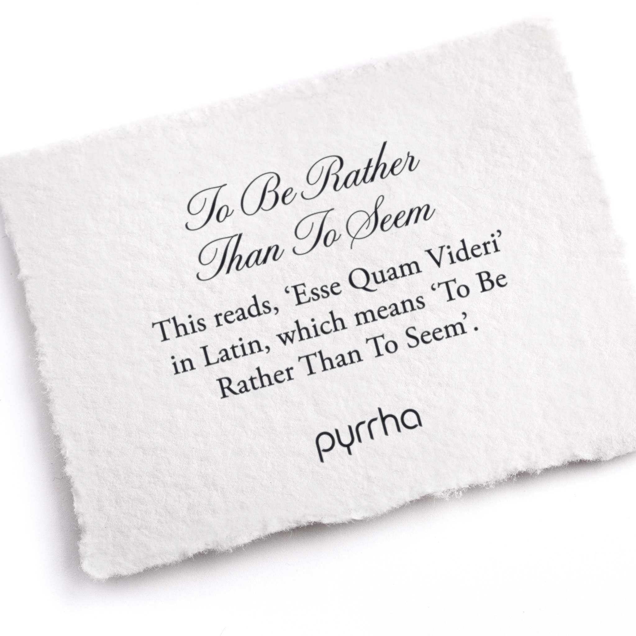 A hand-torn, letterpress printed card describing the meaning for Pyrrha's To Be Rather Than To Seem Ring