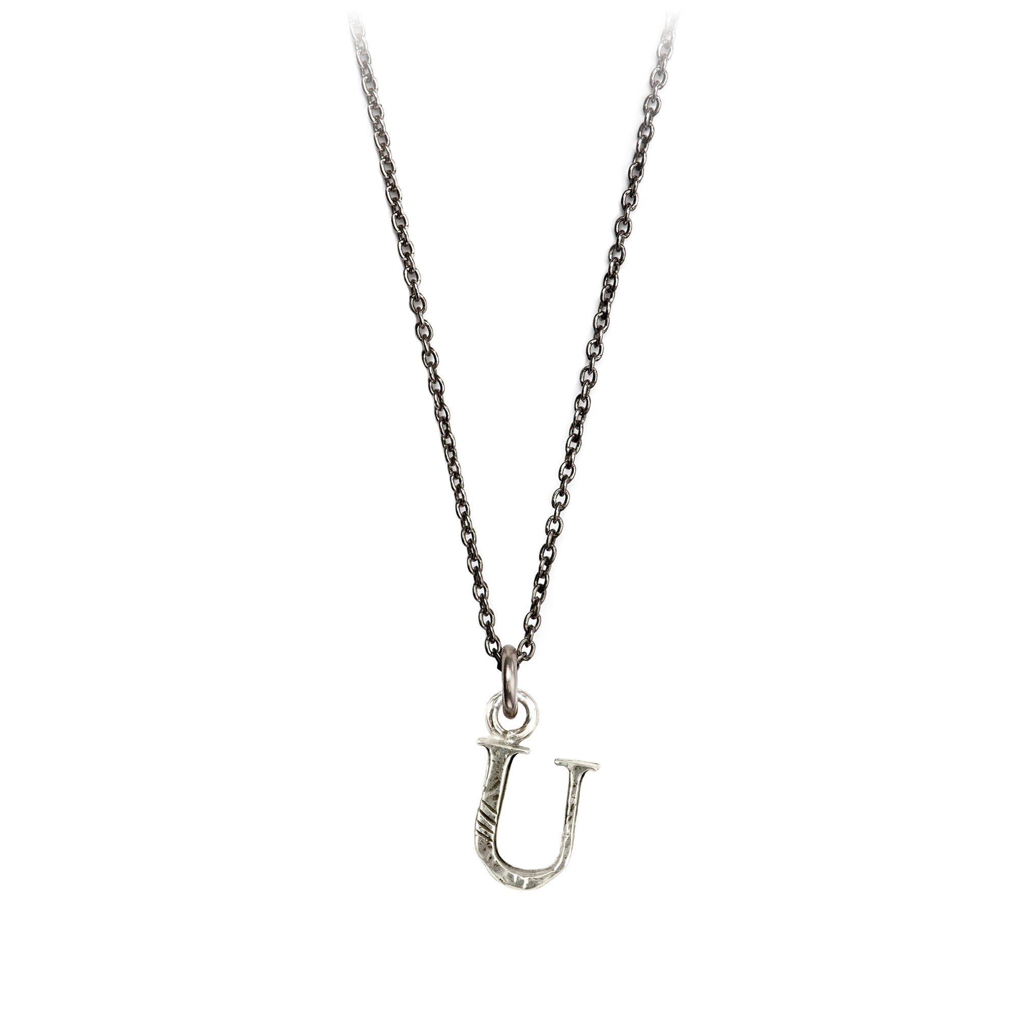 A sterling silver letter "U" charm on a silver chain.