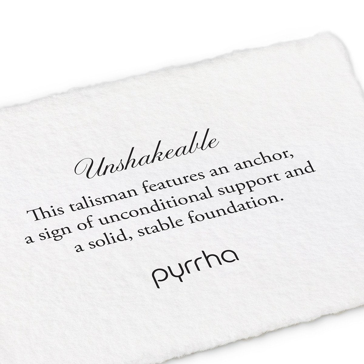 A hand-torn, letterpress printed card describing the meaning for Pyrrha's Unshakeable Talisman