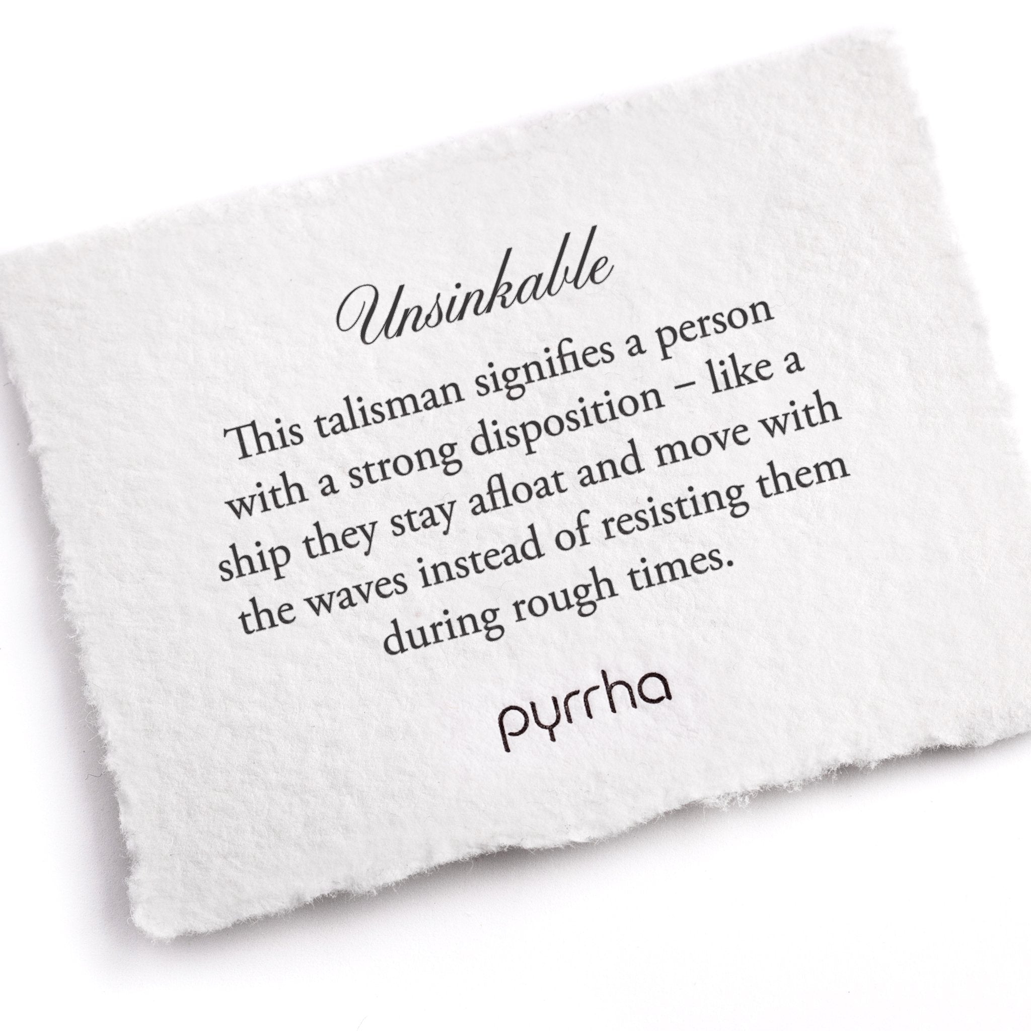 A hand-torn, letterpress printed card describing the meaning for Pyrrha's Unsinkable Talisman