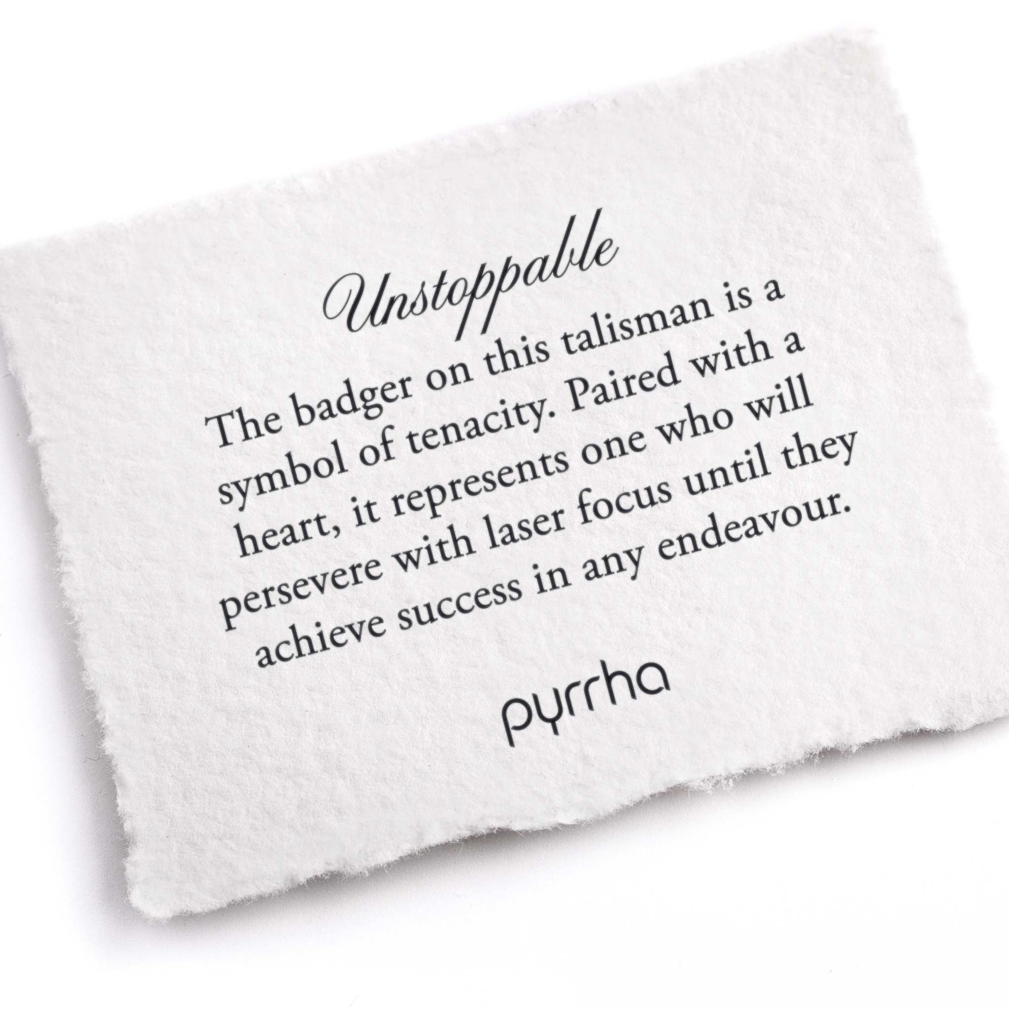 A hand-torn, letterpress printed card describing the meaning for Pyrrha's Unstoppable Talisman