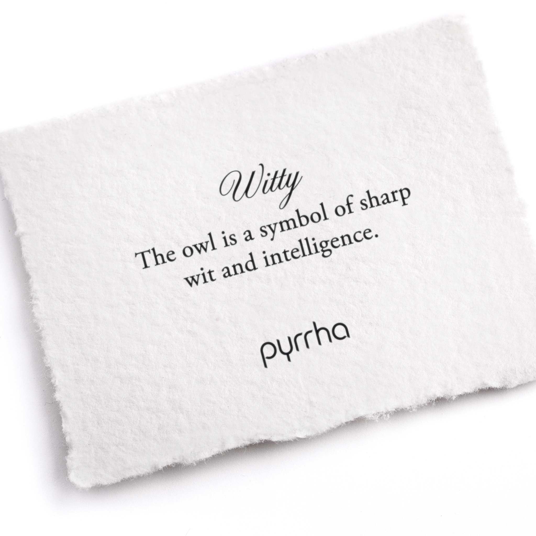 A hand-torn, letterpress printed card describing the meaning for Pyrrha's Witty Appreciation Talisman