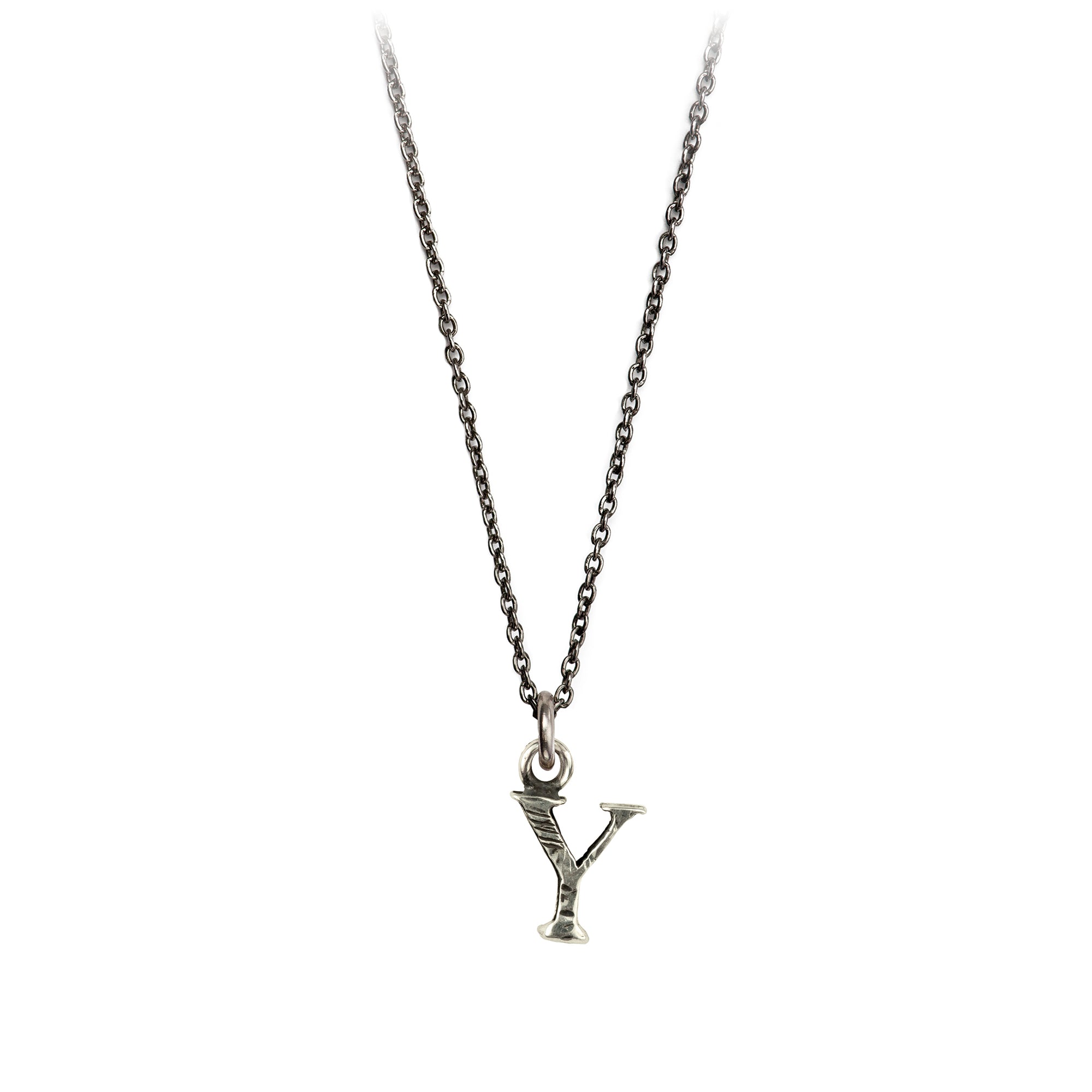 A sterling silver letter "Y" charm on a silver chain.