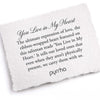 A hand-torn, letterpress printed card describing the meaning for Pyrrha's You Live in My Heart Talisman Chain Bracelet