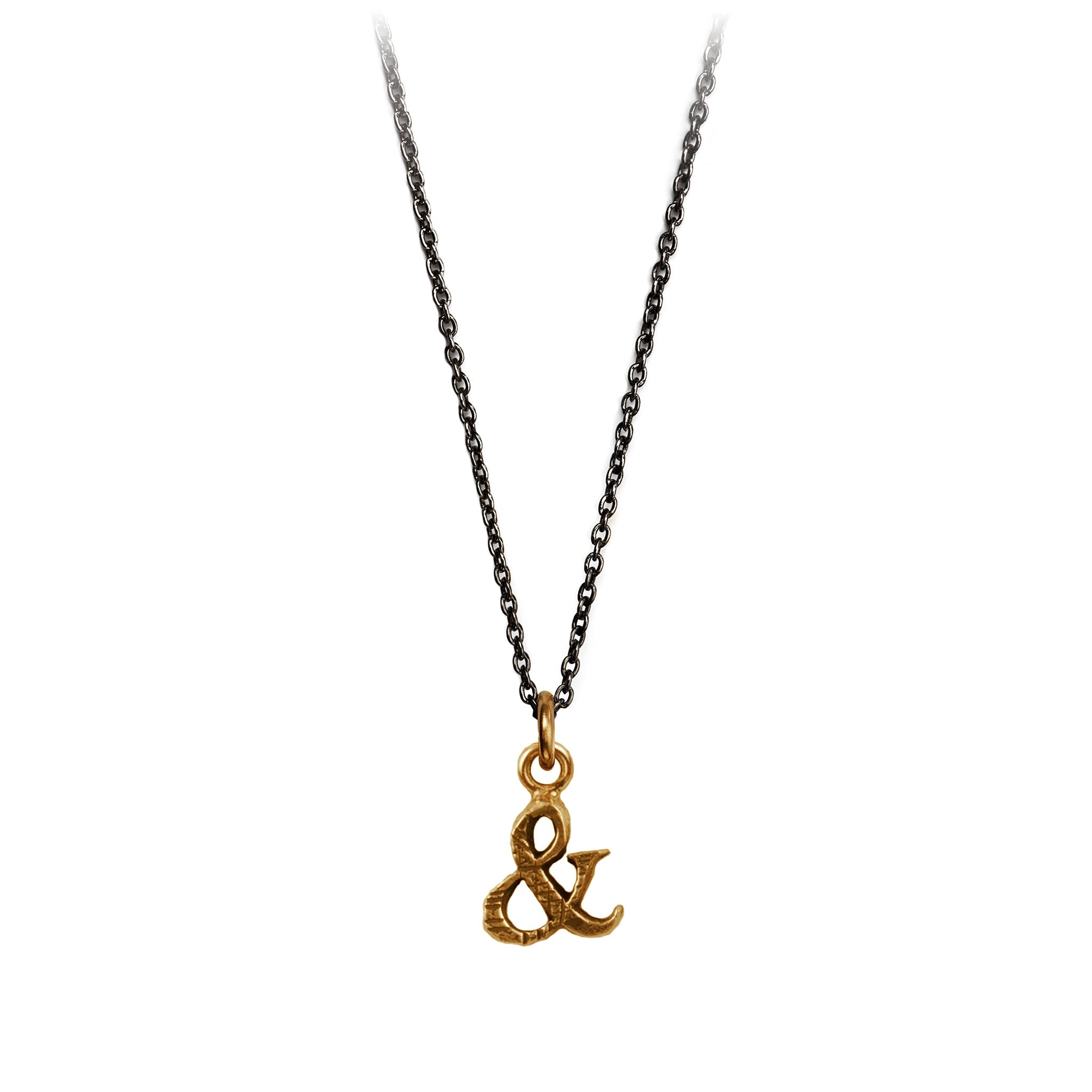 A bronze Ampersand charm on a blackened sterling silver chain.