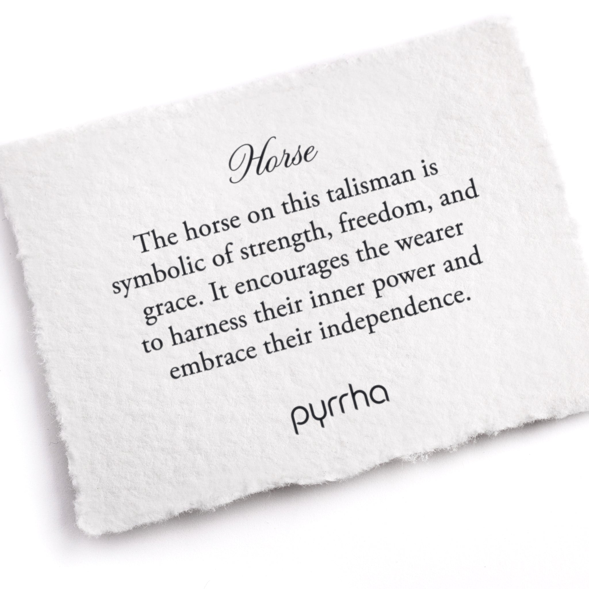 A hand-torn, letterpress printed card describing the meaning for Pyrrha's Horse Talisman