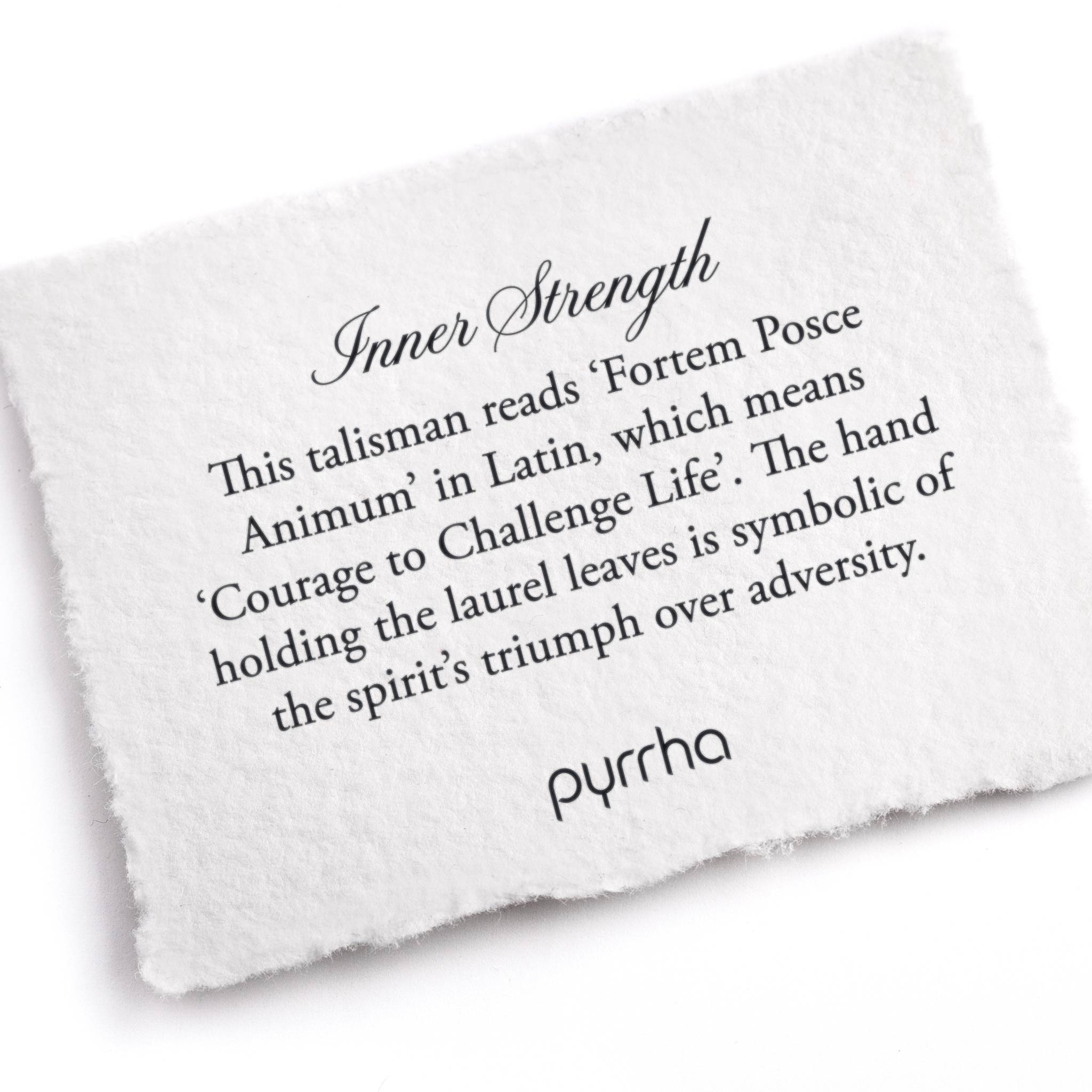 A hand-torn, letterpress printed card describing the meaning for Pyrrha's Inner Strength Talisman