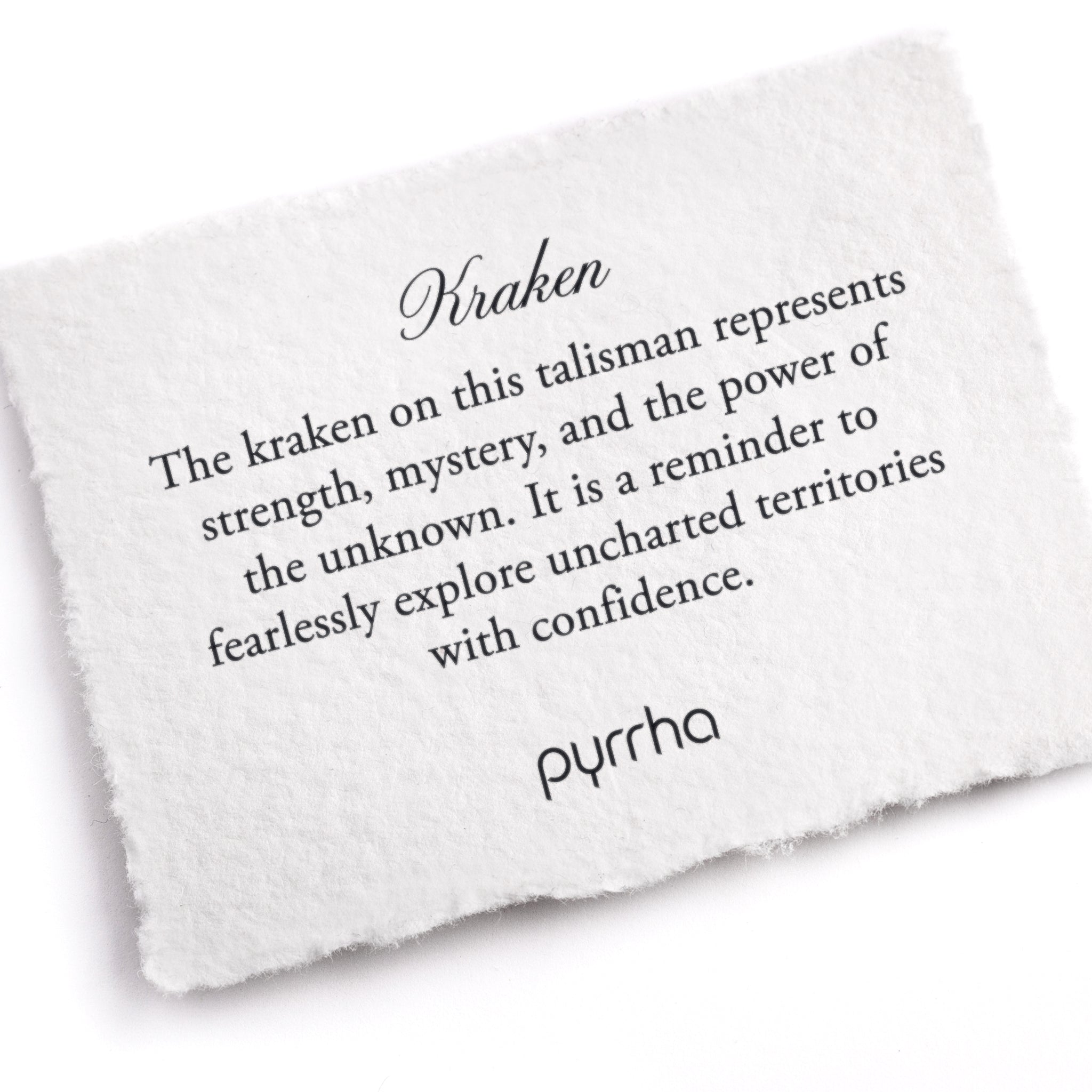 A hand-torn, letterpress printed card describing the meaning for Pyrrha's Kraken Talisman