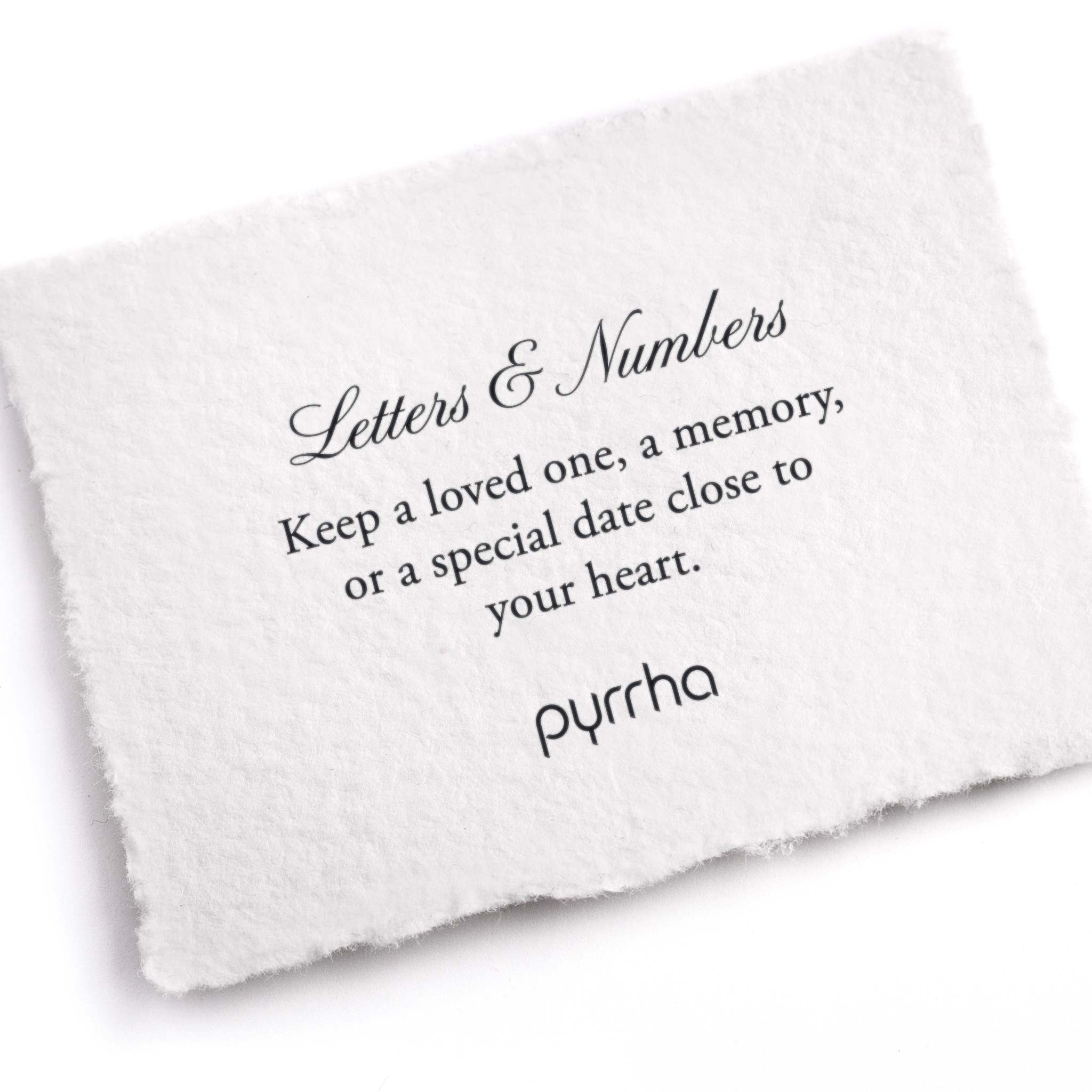 A hand-torn, letterpress printed card describing the meaning for Pyrrha's Letter Charms