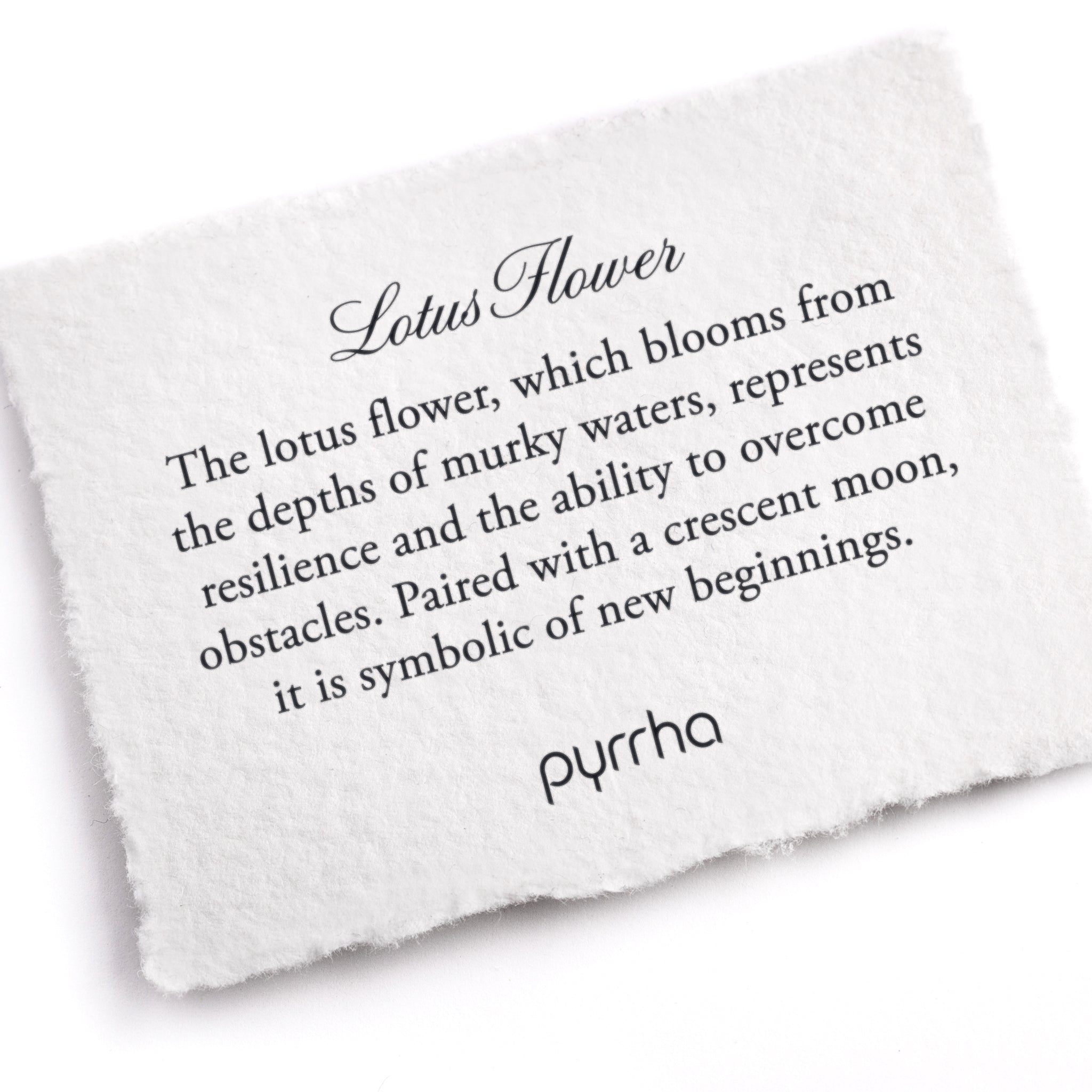 A hand-torn, letterpress printed card describing the meaning for Pyrrha's Lotus Flower Talisman