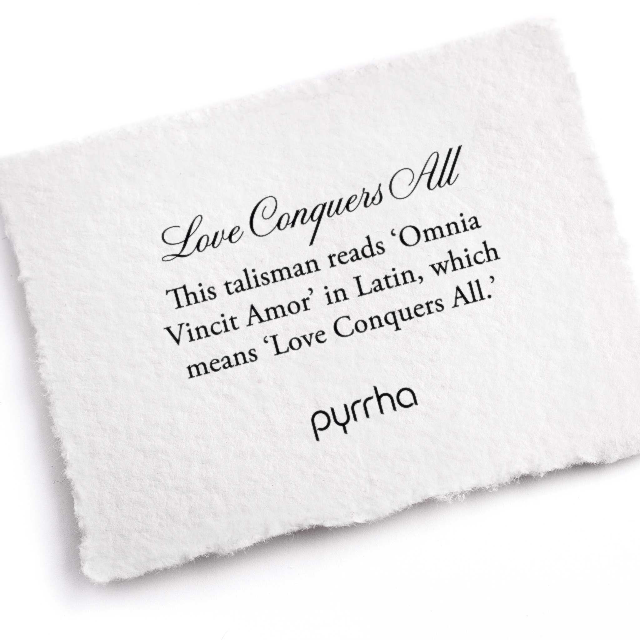 A hand-torn, letterpress printed card describing the meaning for Pyrrha's Love Conquers All Talisman