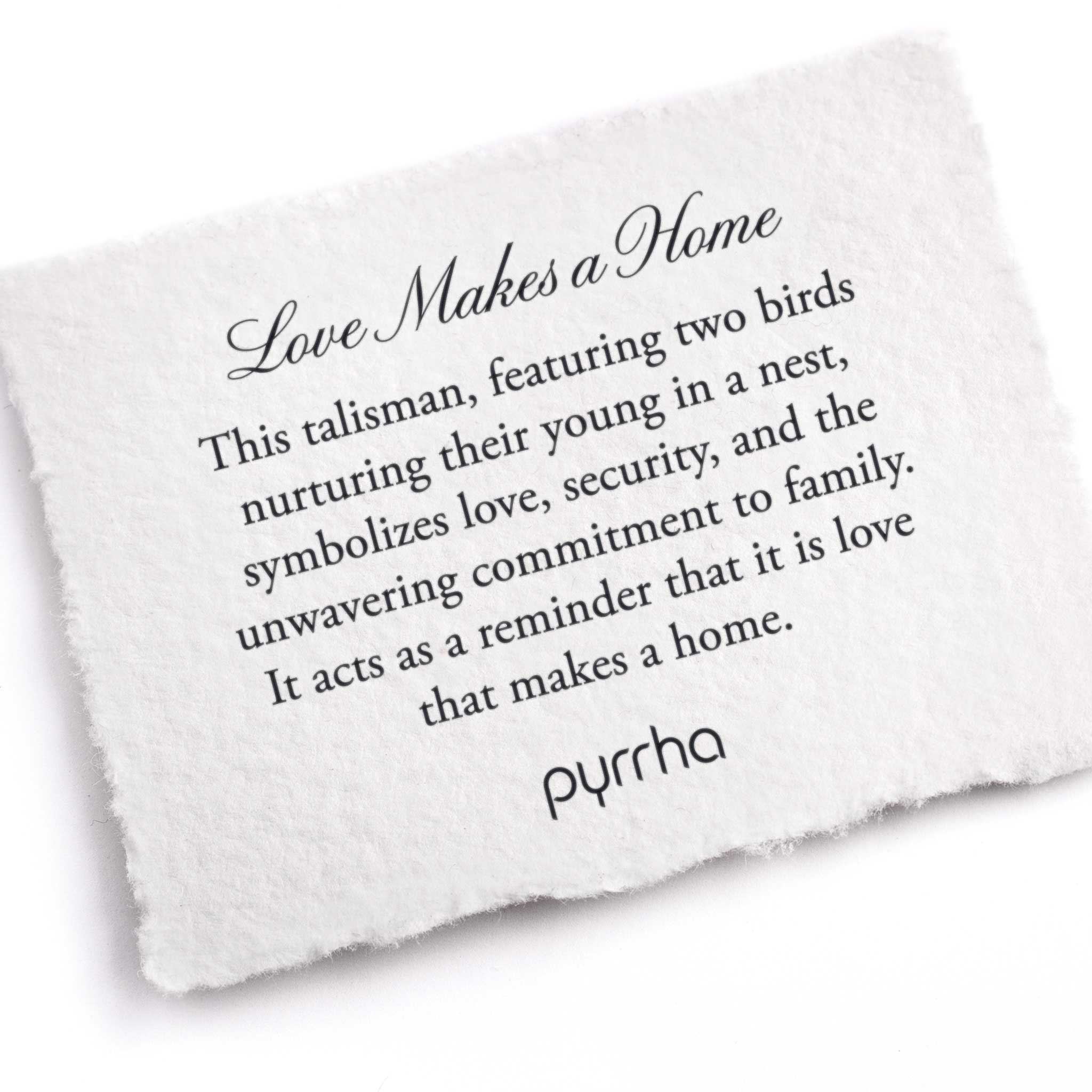 A hand-torn, letterpress printed card describing the meaning for Pyrrha's Love Makes a Home Talisman