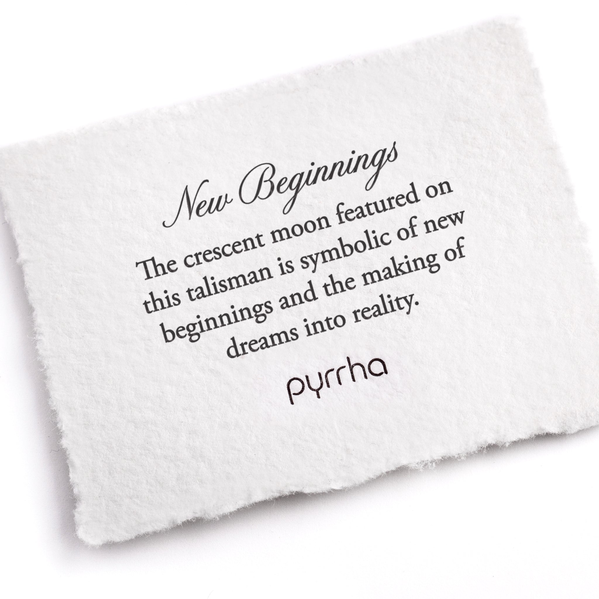 A hand-torn, letterpress printed card describing the meaning for Pyrrha's New Beginnings Talisman