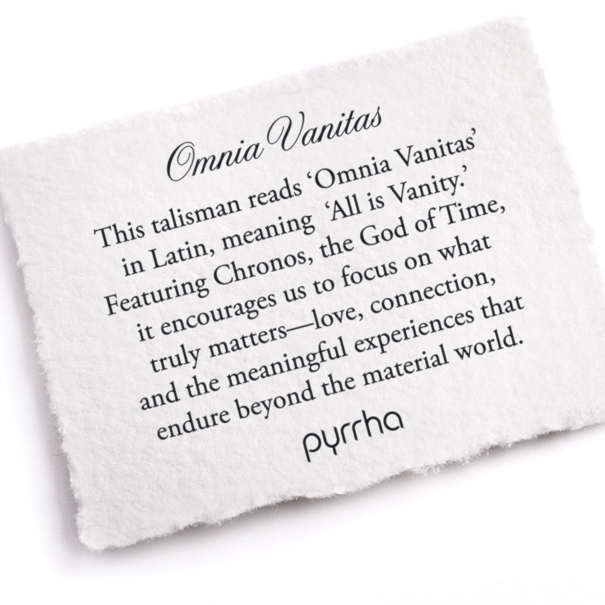 A hand-torn, letterpress printed card describing the meaning for Pyrrha's Omnia VanitasTalisman