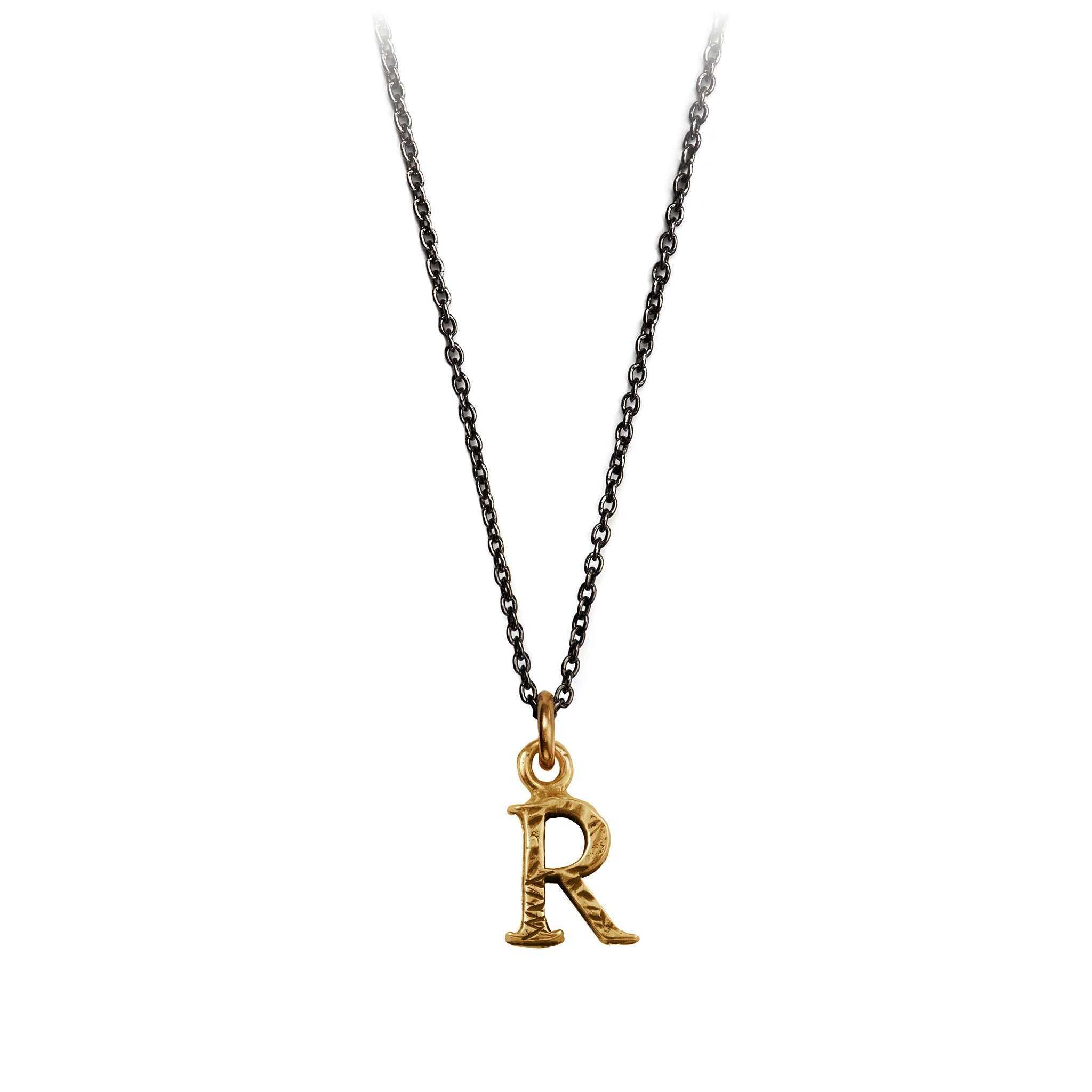 A bronze "R" charm on a blackened sterling silver chain.