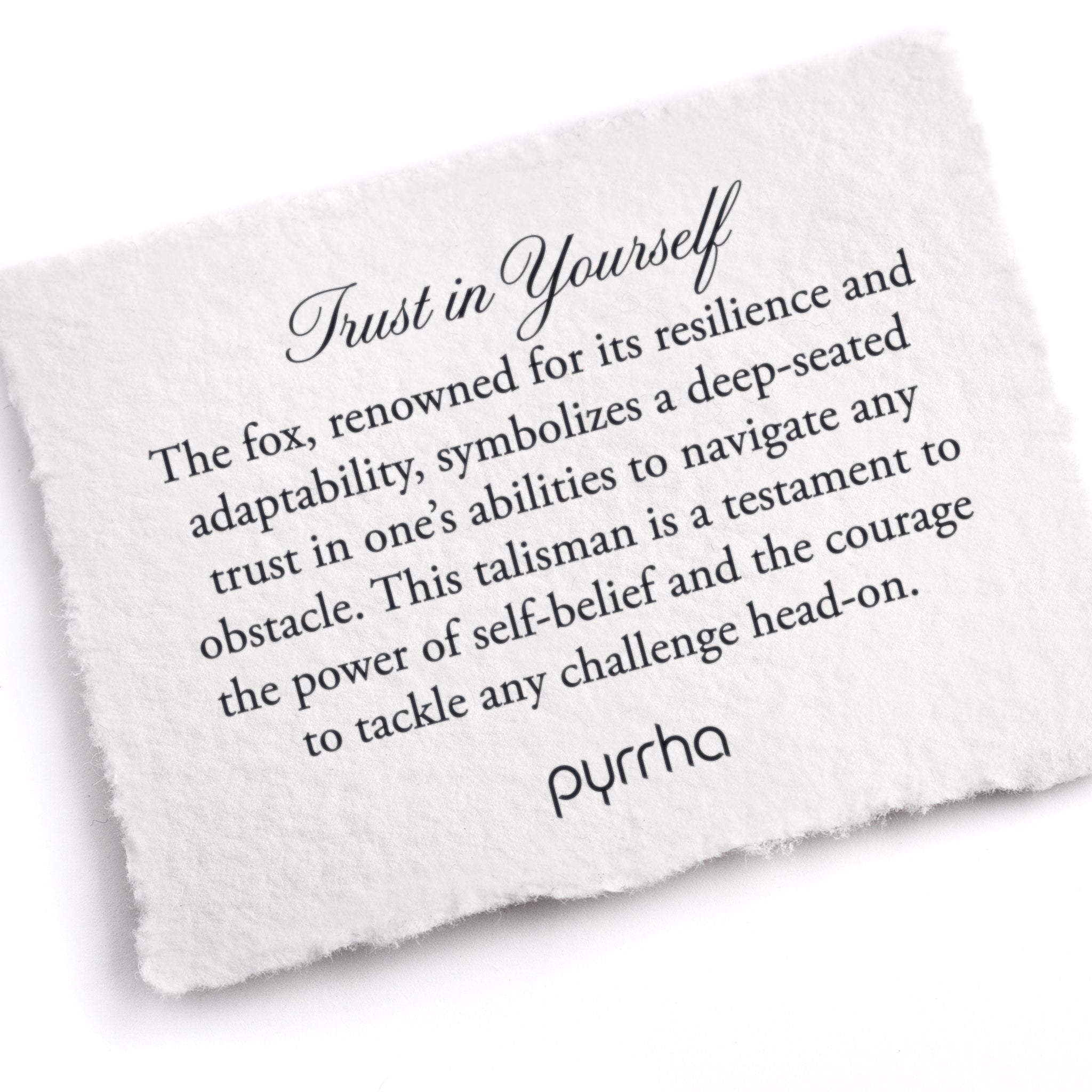 A hand-torn, letterpress printed card describing the meaning for Pyrrha's Trust in Yourself Talisman