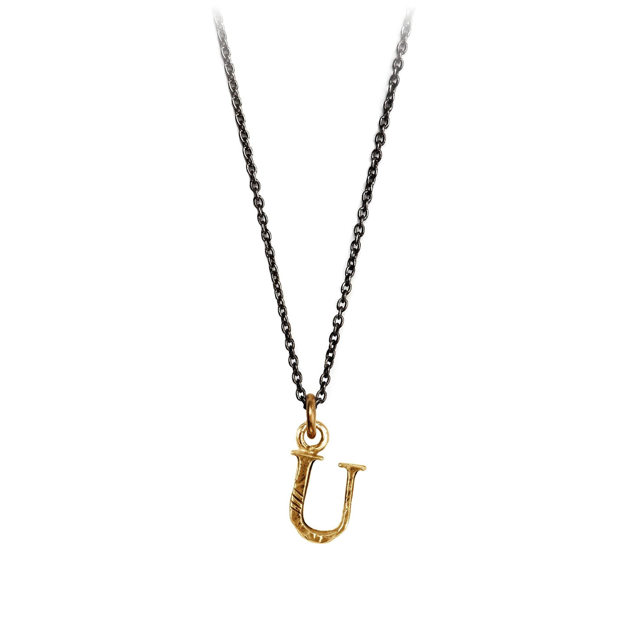 A bronze letter "U" charm on a blackened silver chain.