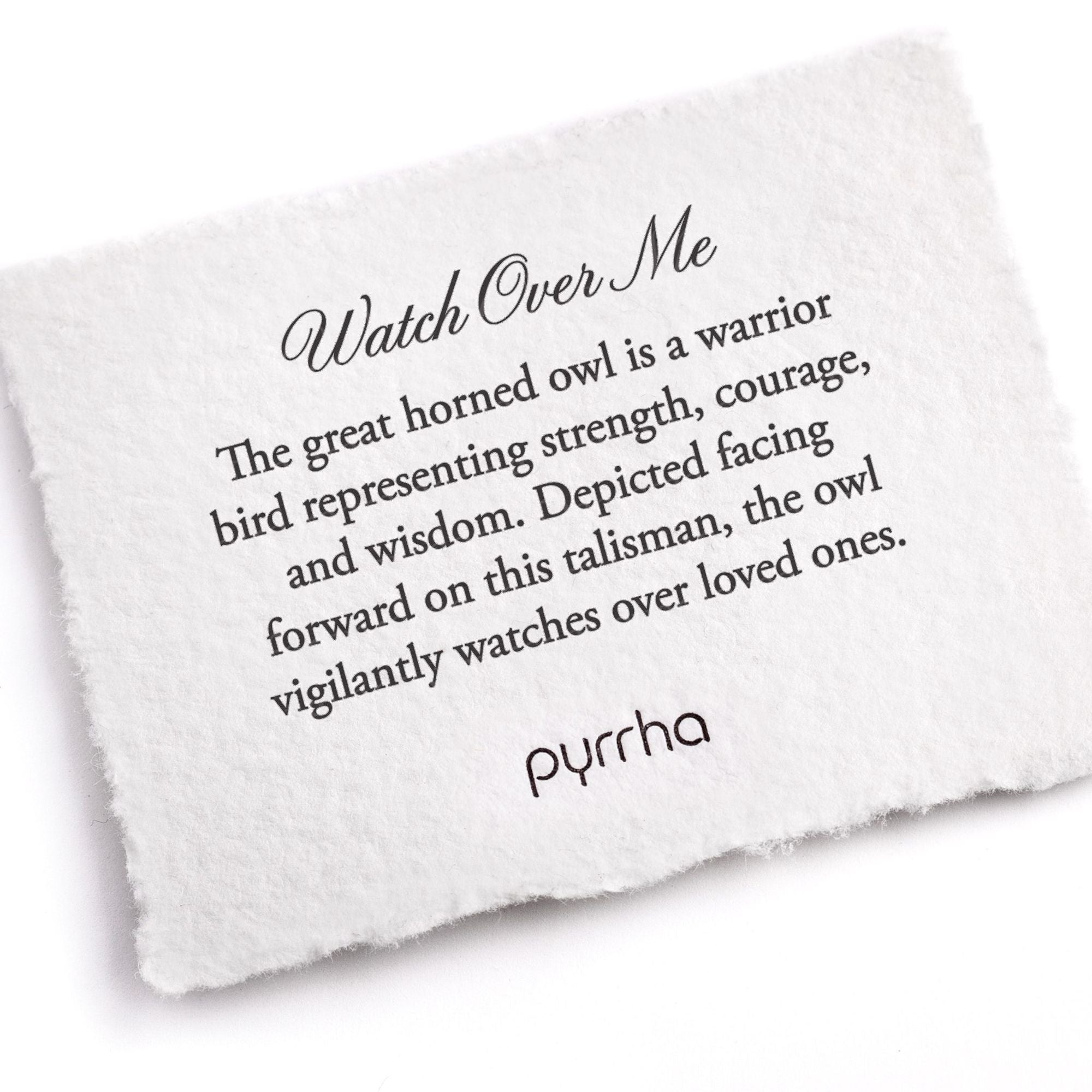 A handtorn cotton card describing the meaning for our Watch Over Me Signet Ring.