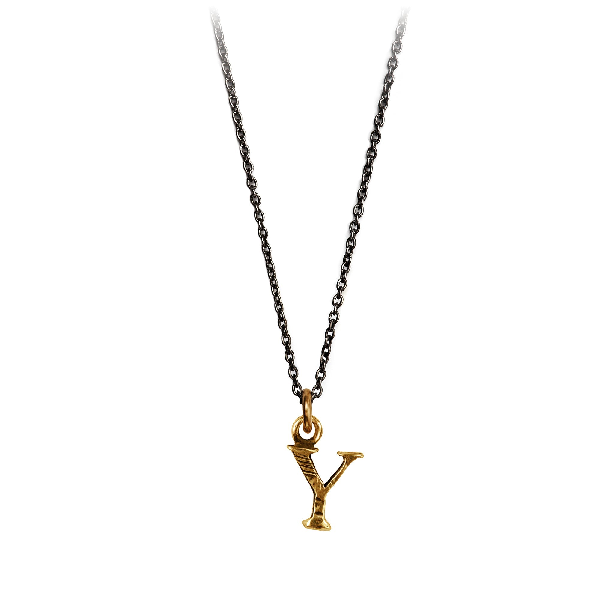 A bronze letter "Y" charm on a blackened silver chain.