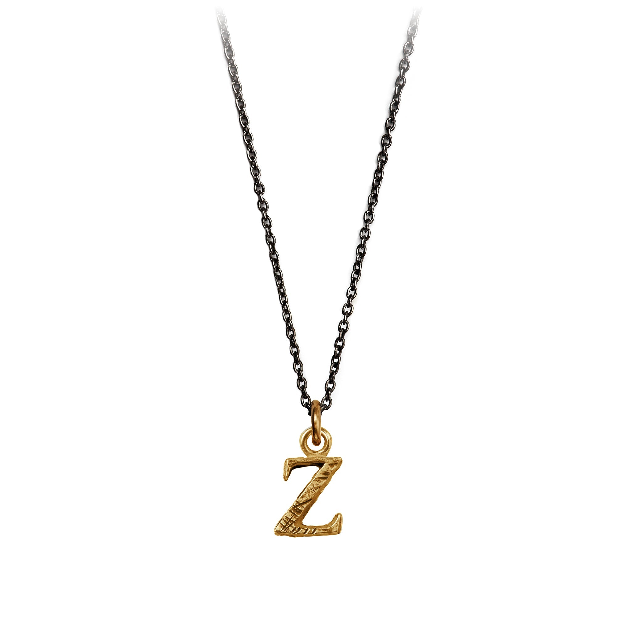 A bronze letter "Z" charm on a blackened silver chain.