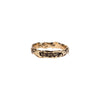 A 14k gold narrow textured band ring with the phrase From Here On  in latin printed on the band.