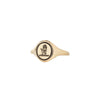A 14 karat gold ring with our Hand and Heart signet pictured on the top.