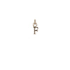 A 14k gold charm in the shape of the letter "F".