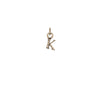 A 14k gold charm in the shape of the letter "K".