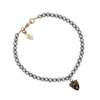 A hand-knotted bracelet of dove grey pearls featuring our 14k gold moon and stars talisman.