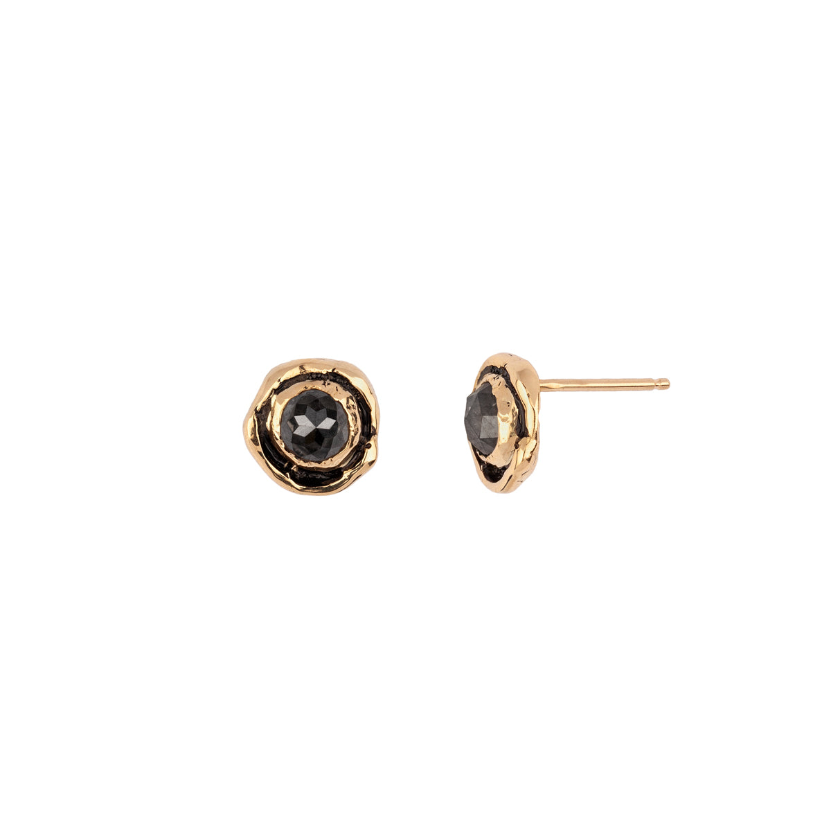 A set of 14k gold stud earrings featuring Charcoal Rustic Diamonds.