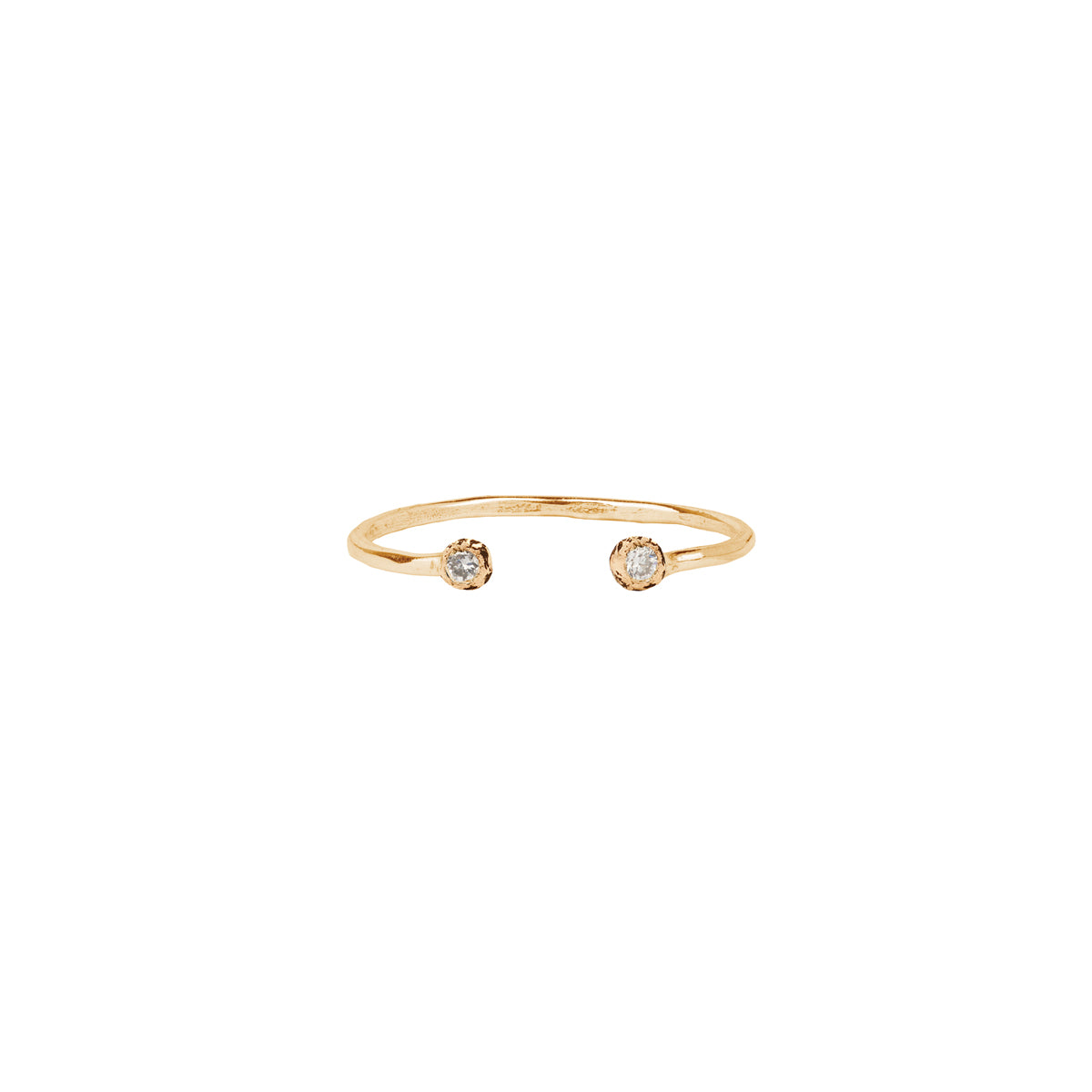An open 14k gold ring featuring a gold set white diamond.