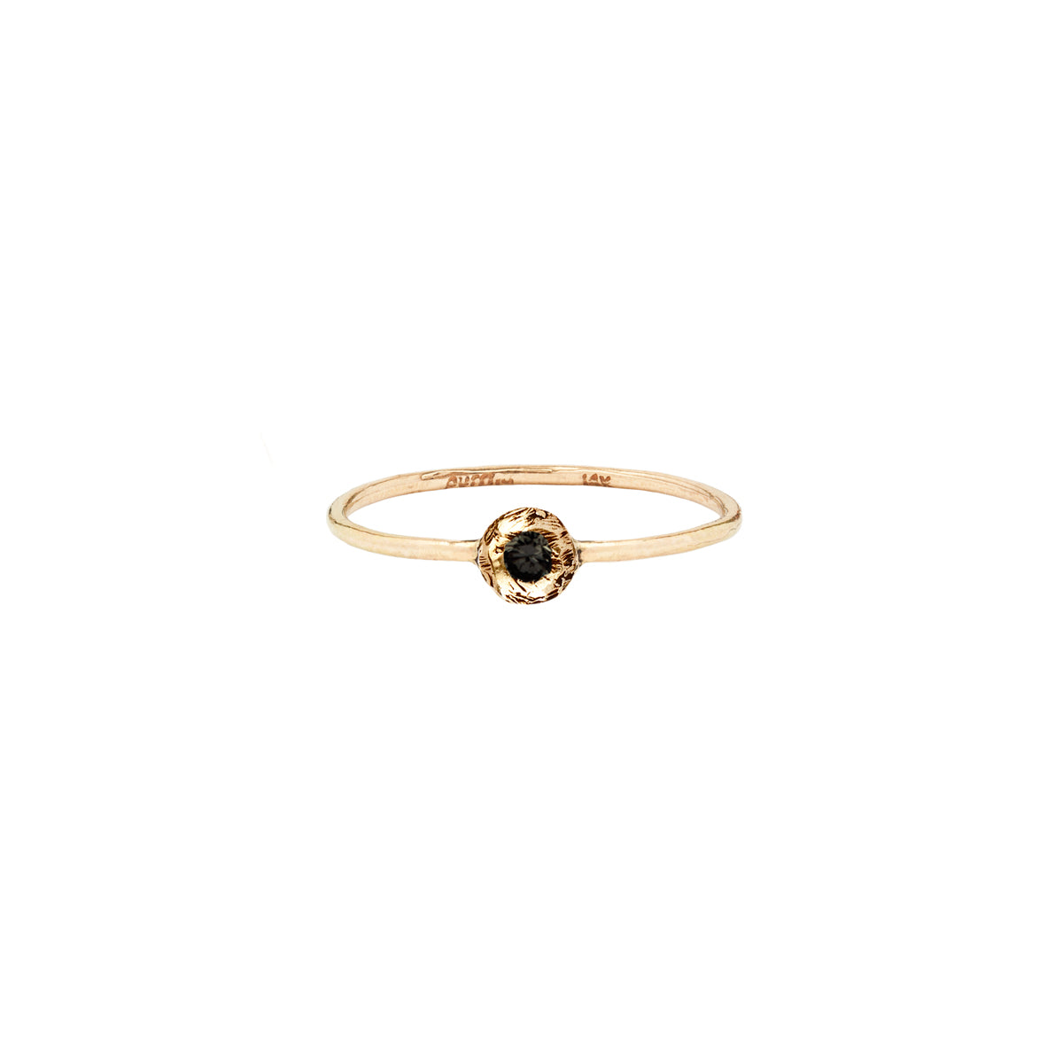 A 14k gold ring featuring a gold set black diamond.