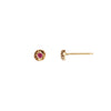 A set of 14k gold stud earrings featuring rubies set on large gold nuggets.