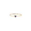 A 14k gold ring featuring a gold set sapphire.