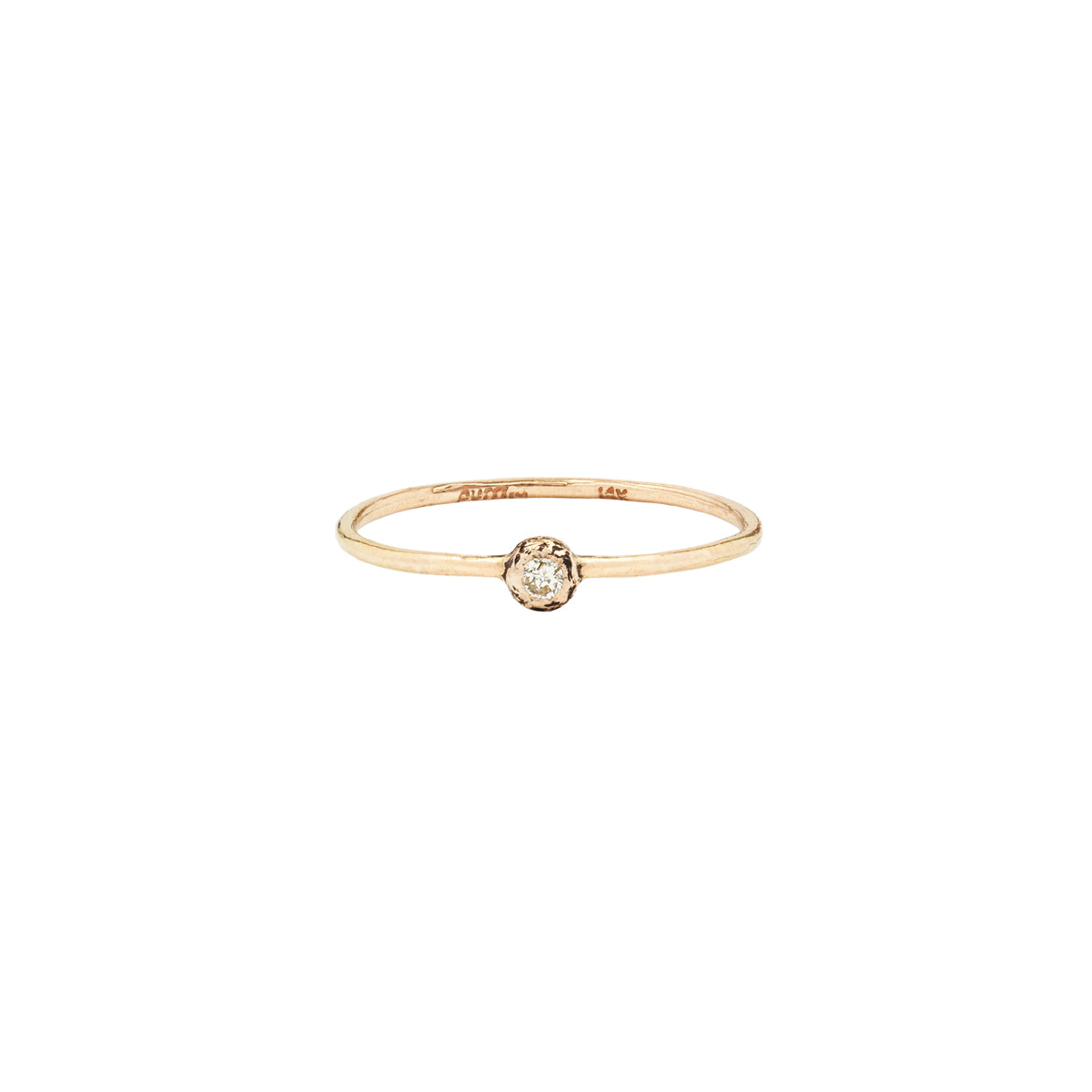 A 14k gold ring featuring a gold set white diamond.