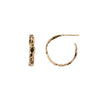 A set of small 14k gold hoop earrings set with a black diamond.