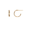 A set of extra small 14k gold hoop earrings with a textured design.
