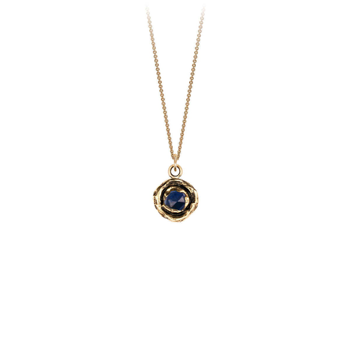 A 14k gold chain featuring a large 14k gold faceted sapphire.