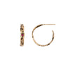 A set of small 14k gold hoop earrings set with a ruby.