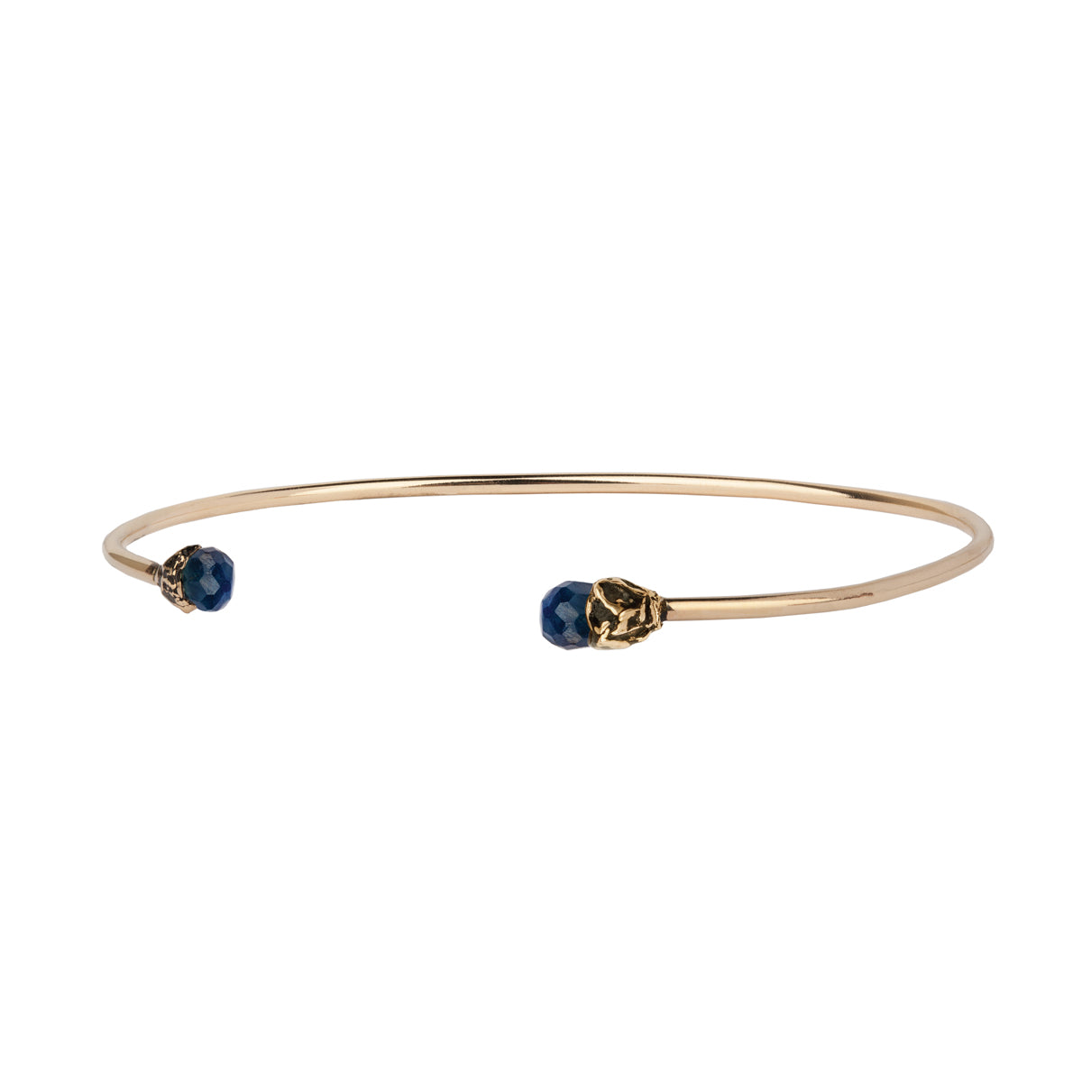 A 14k gold bangle made to hold charms capped with a semi precious sapphire stone representing loyalty.