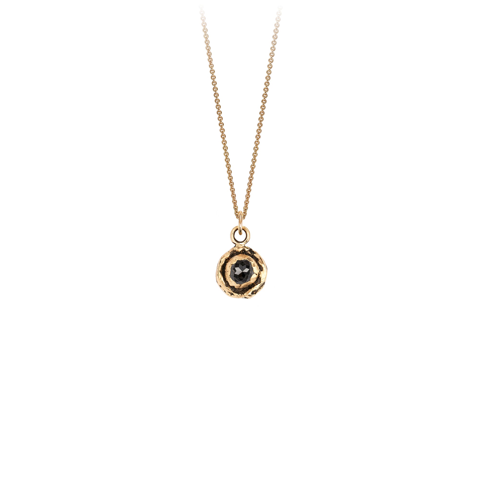 A 14k gold chain featuring a small 14k gold faceted charcoal diamond.