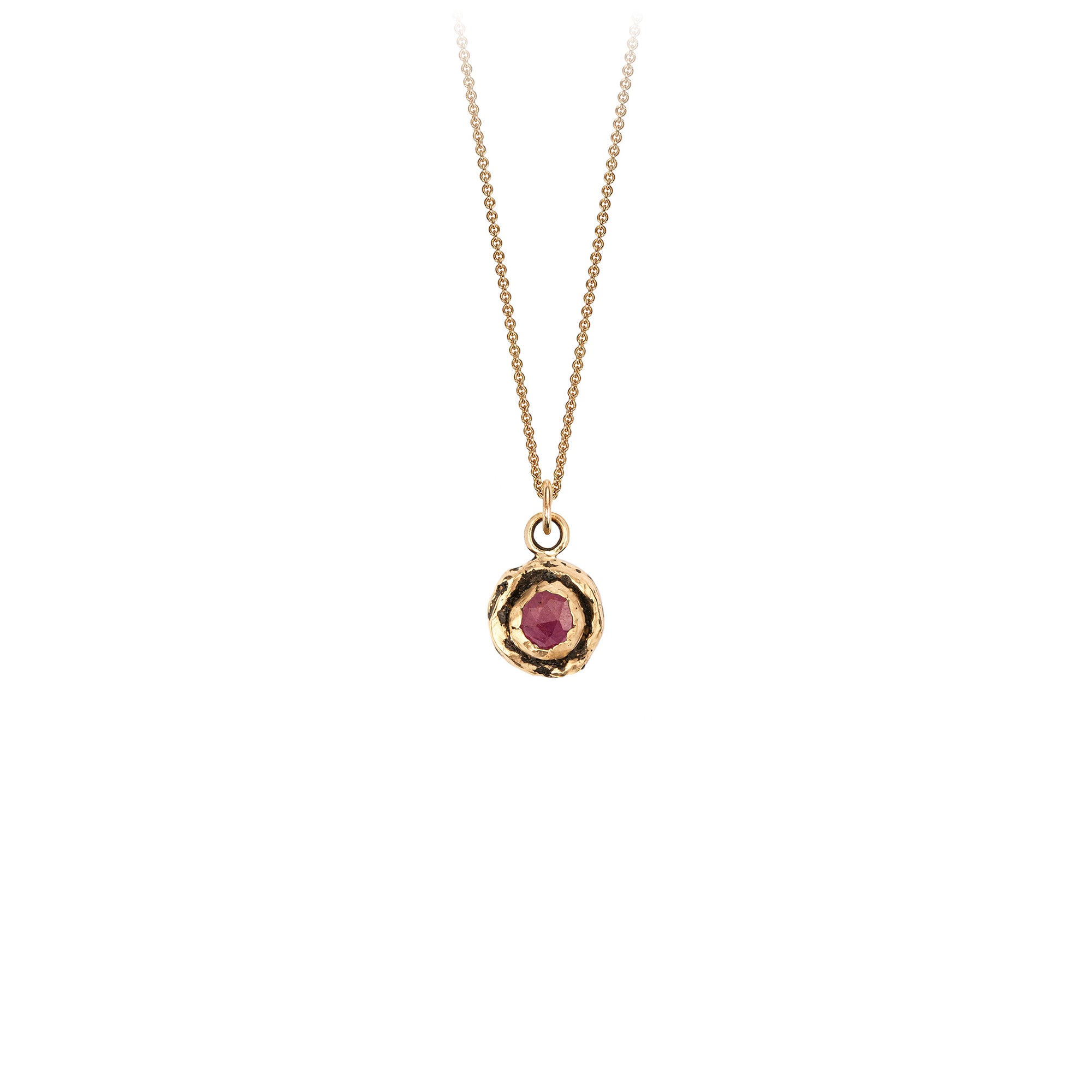 A 14k gold chain featuring a small 14k gold faceted ruby.