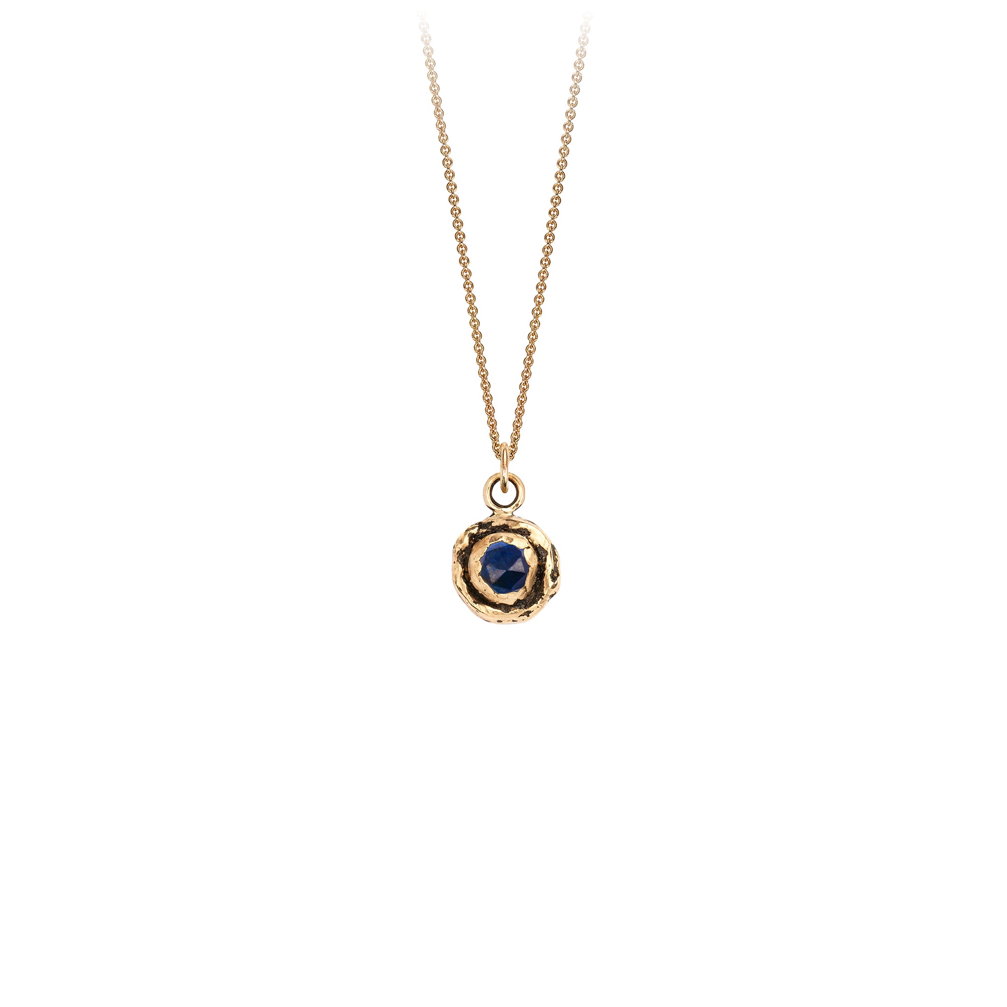 A 14k gold chain featuring a small 14k gold faceted sapphire.